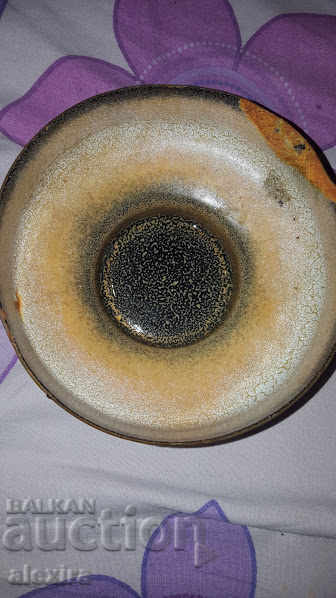 a beautiful copper or bronze ornament bowl