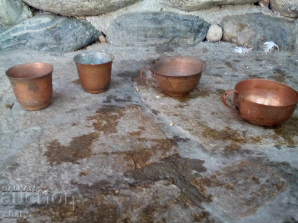 Old copper cups.