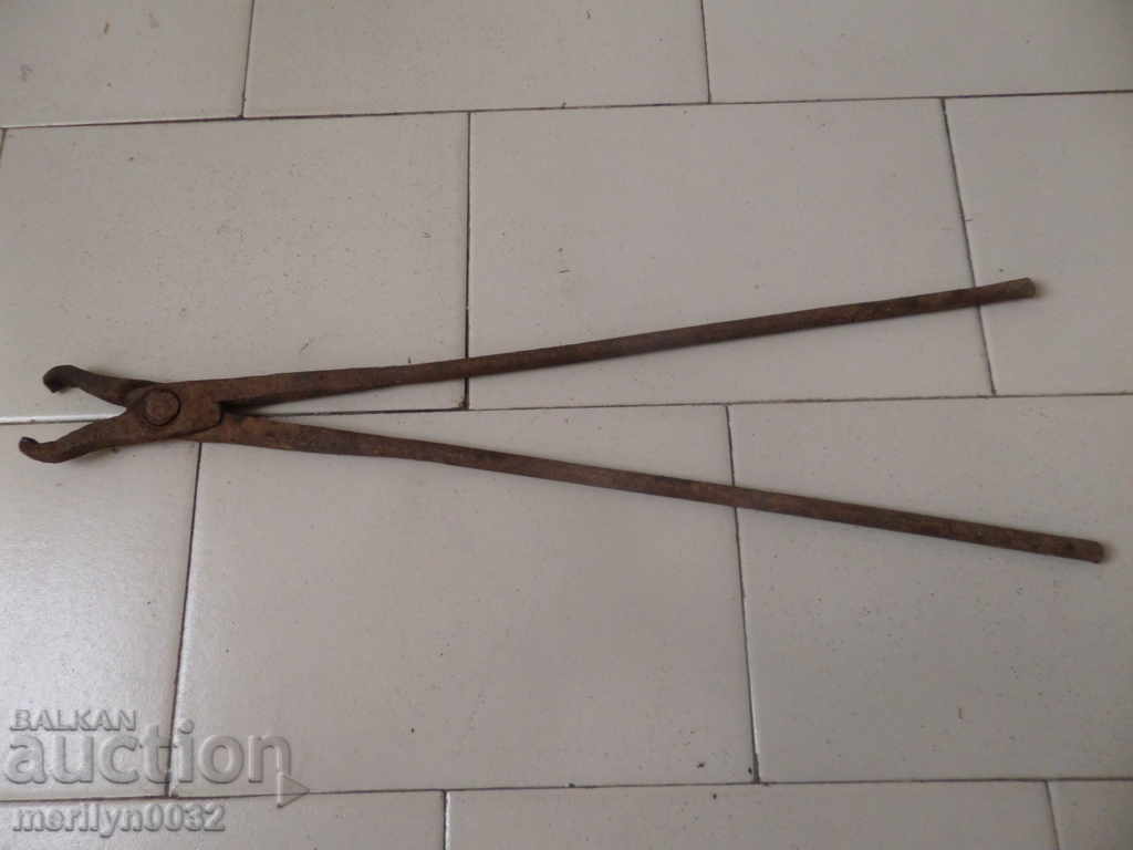 Delivery of Old forging pliers, wrought iron, tool