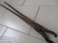Old forging pliers, wrought iron, tool