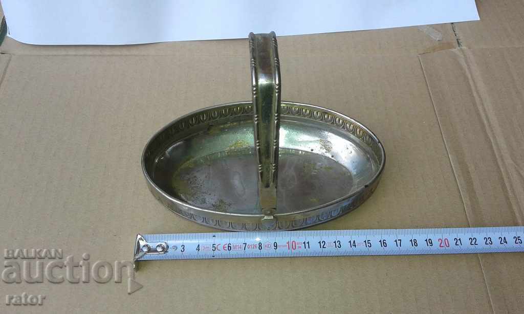 An old metallic, bronze basket for nuts, candy