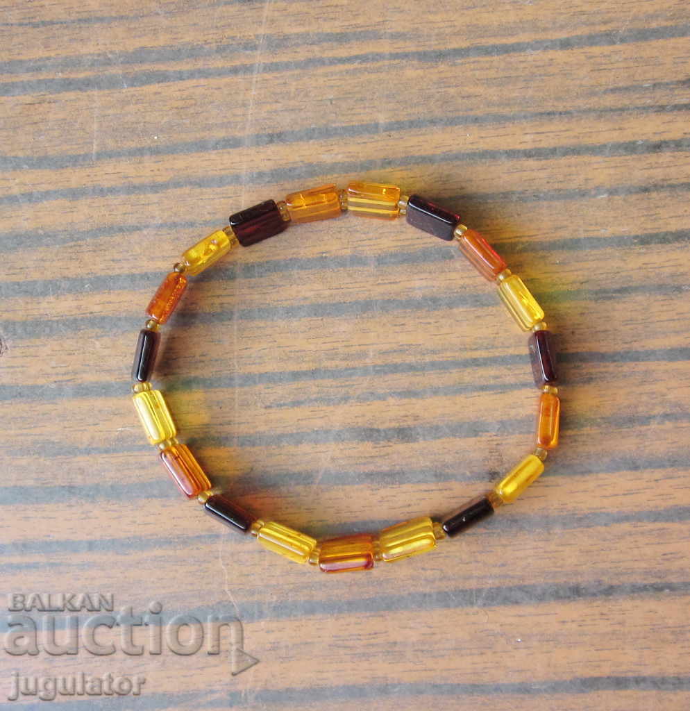 Delivery of Ladies bracelet jewelery from natural colorful amber