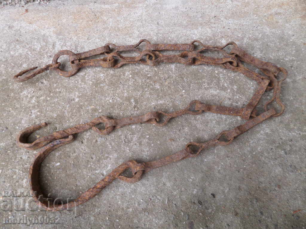 Old forged chain with hook, hearth for hearth chain hook