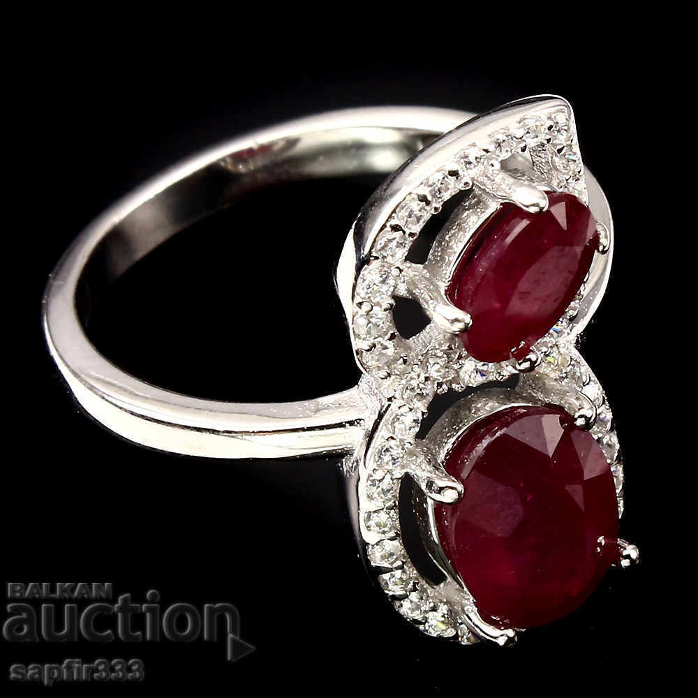 Auction  DESIGNER BOUTIC RING WITH NATURAL RUBBERS AND CYCLONS