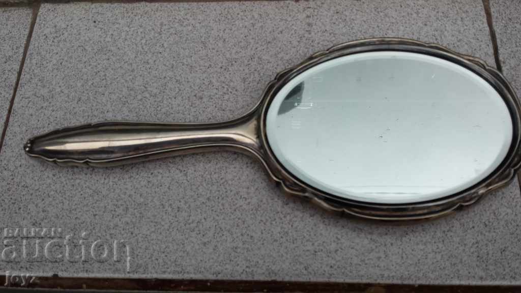 An antique silver crystal mirror