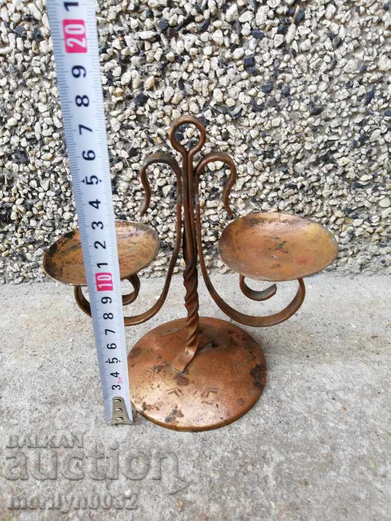 Delivery of Old wrought copper candlestick from the social period, candle Delivery of Old wrought copper candlestick from the social period, candle