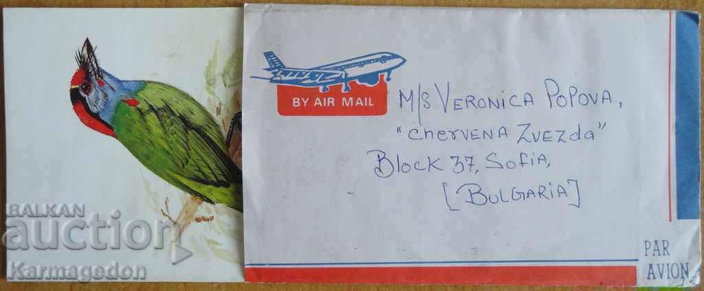 Traveled envelope with postcard from India, 1980s