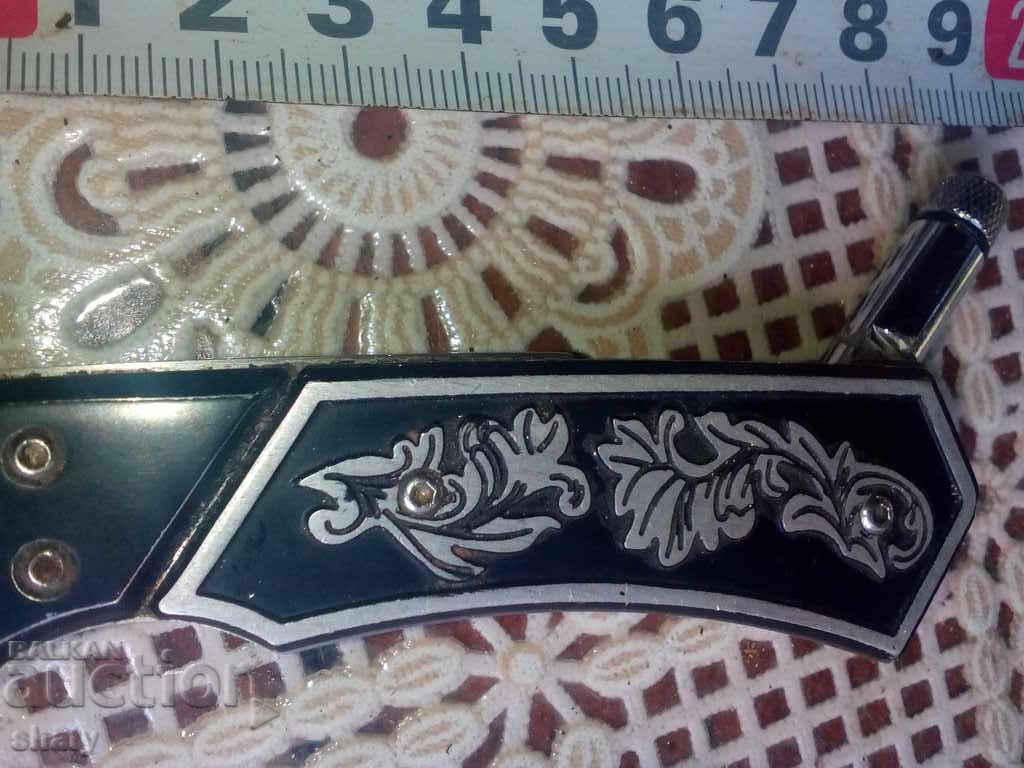 Delivery of German automatic knife with flashlight.