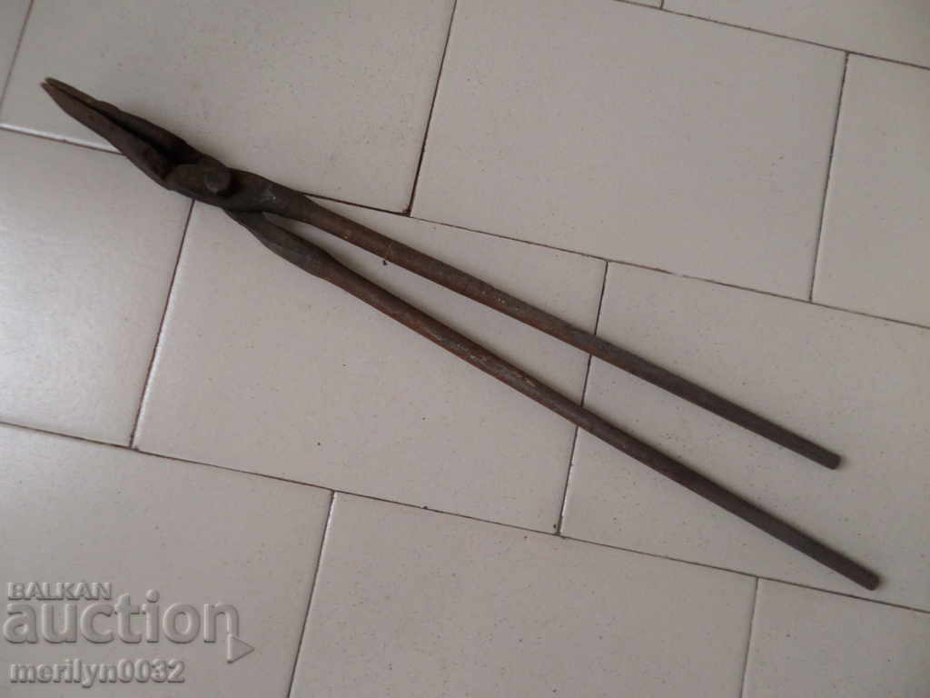 Old forging pliers, wrought iron, tool