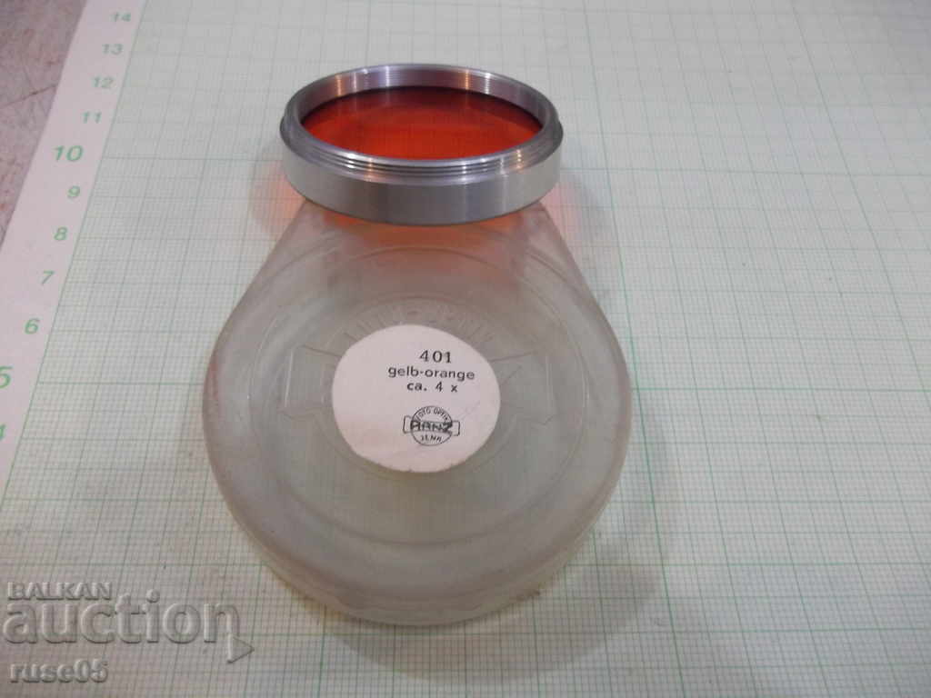 Auction  Photo filter (gelb-orange ca. 4x / u.- 49 mm.)
