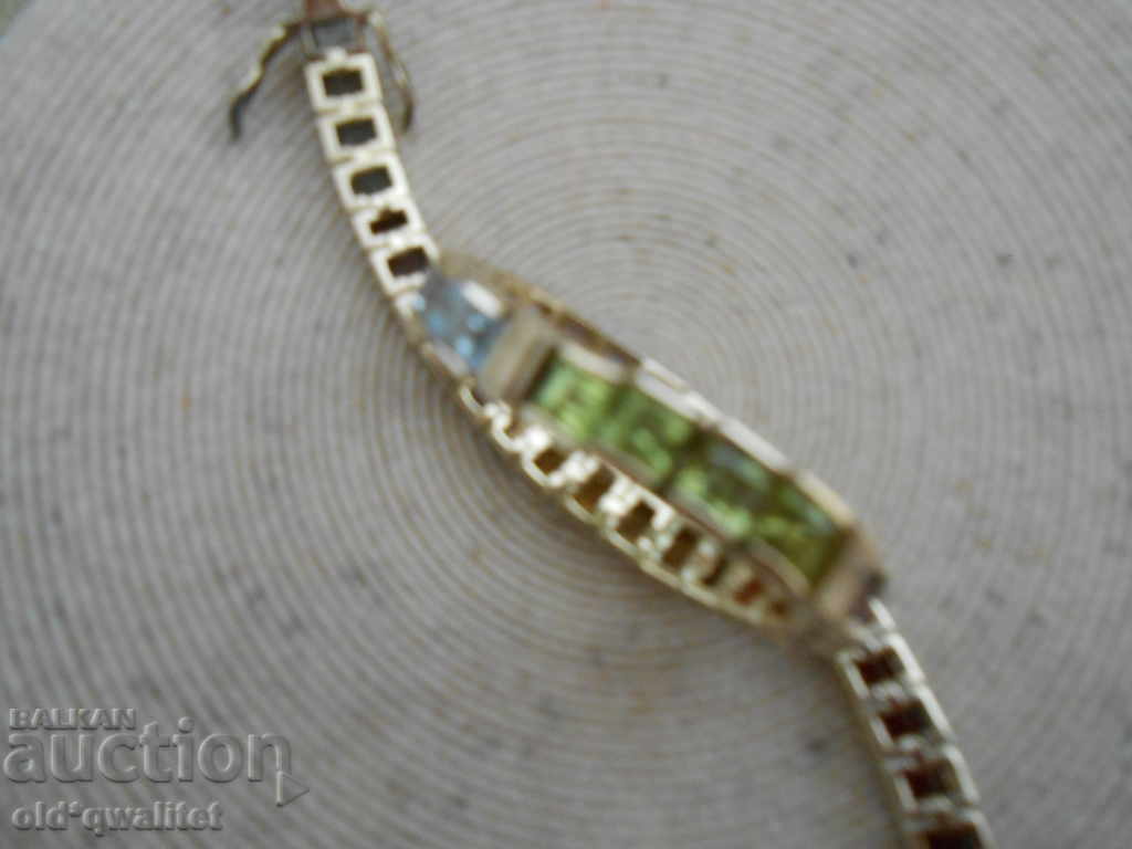 Auction  ATTRACTIVE SILVER GRAY with multicolored gilded stones