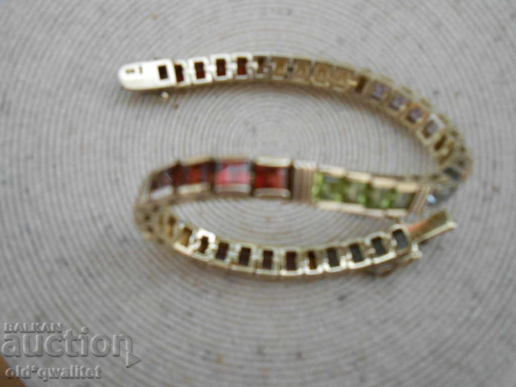 Delivery of ATTRACTIVE SILVER GRAY with multicolored gilded stones