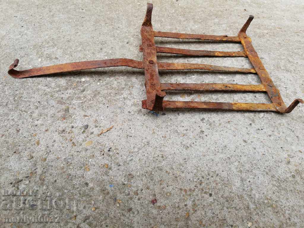 Delivery of An old hand-forged grill, a steak, wrought iron Delivery of An old hand-forged grill, a steak, wrought iron