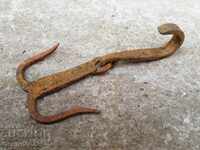 Old forged skinning hook, shackle, wrought iron anchor