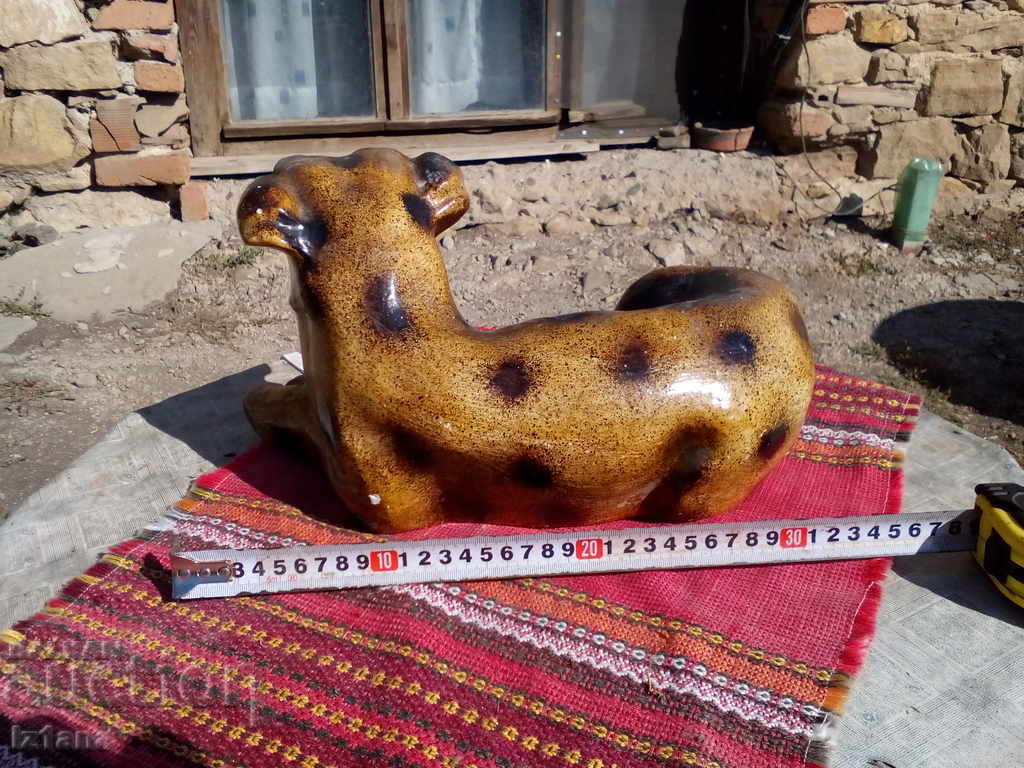 Auction  An old porcelain figure, a dog