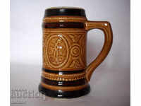 Embossed ceramic old German mug