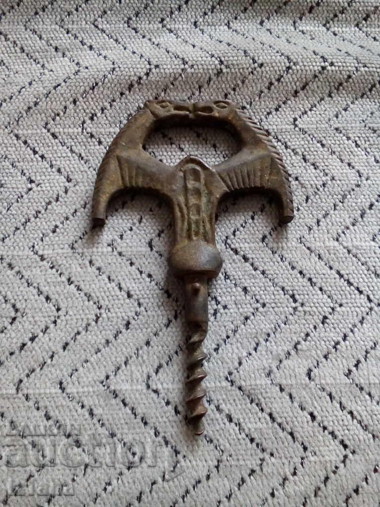 Auction An old bottle opener Auction An old bottle opener