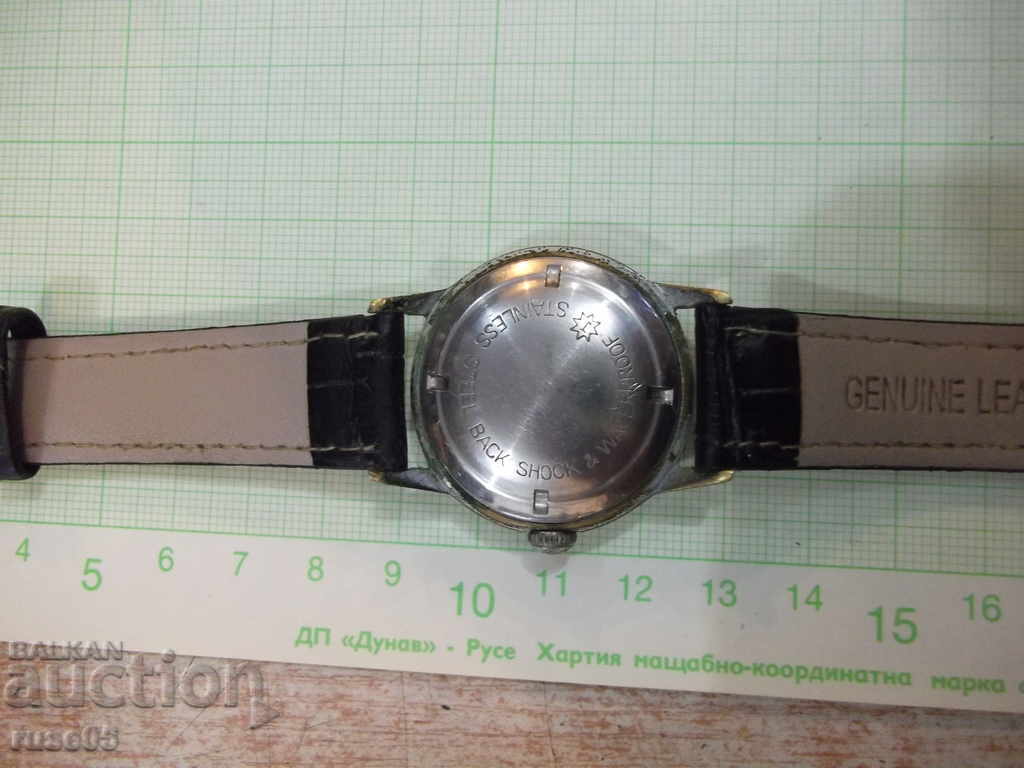 Auction Clock "JUNGHANS - TRILASTIC" handmade man working Auction Clock "JUNGHANS - TRILASTIC" handmade man working