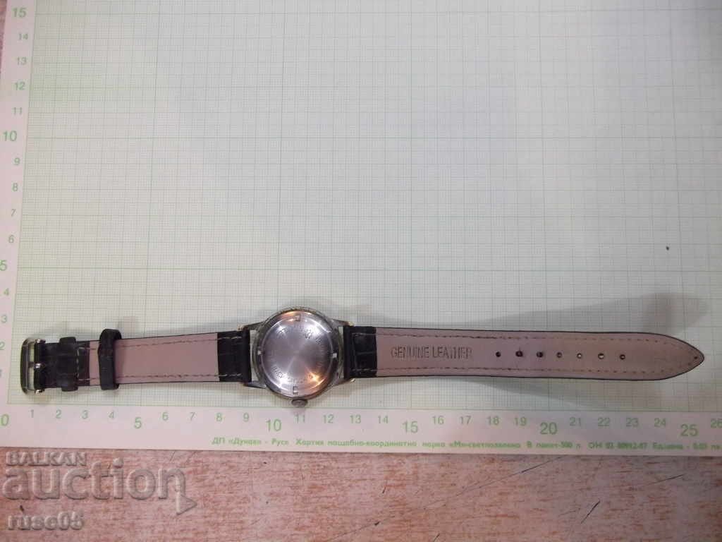 Delivery of Clock "JUNGHANS - TRILASTIC" handmade man working Delivery of Clock "JUNGHANS - TRILASTIC" handmade man working