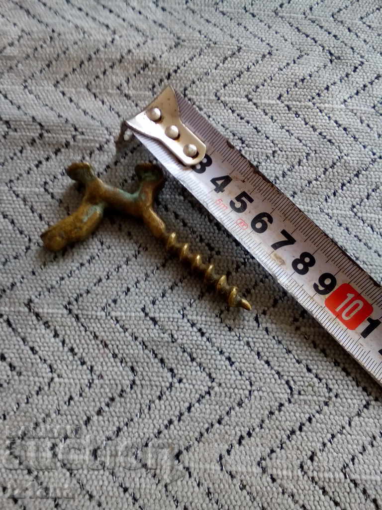 Auction An old bottle opener Auction An old bottle opener