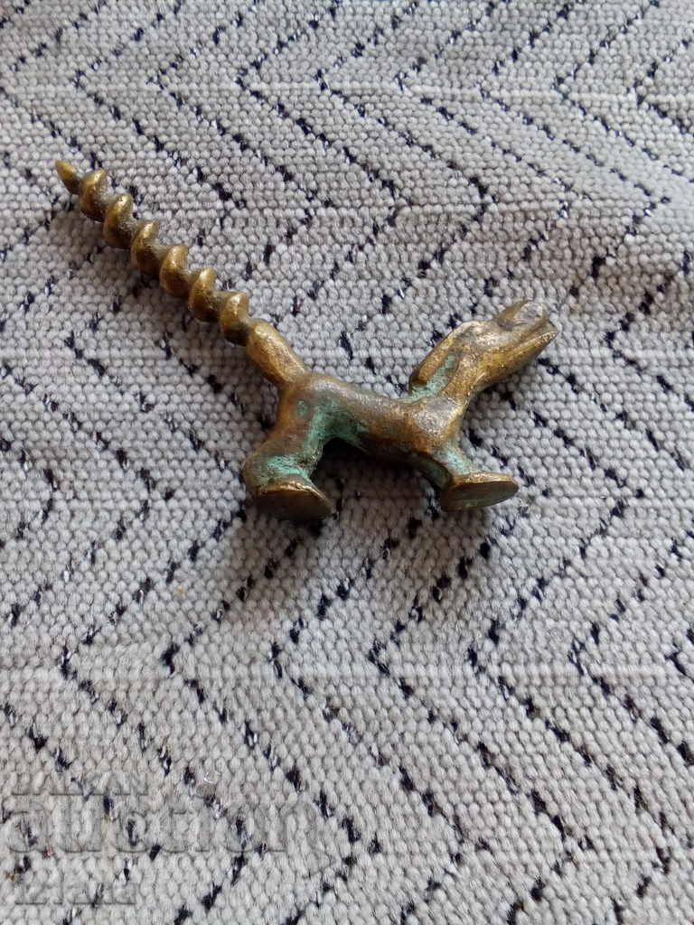 An old bottle opener An old bottle opener