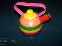 An old plastic teapot toy