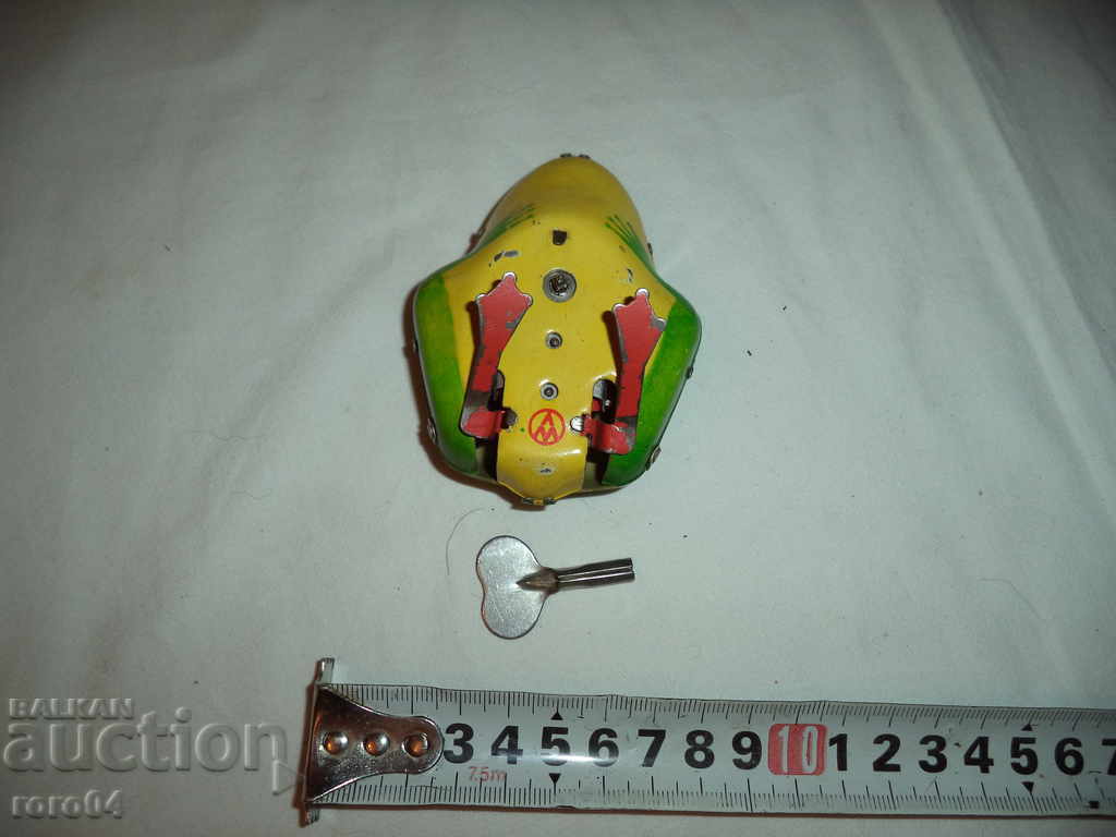 Auction  OLD SHEET METAL MECHANICAL FROG WITH KEY