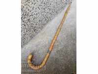 An old walking stick made of bamboo wood. of the 20th century