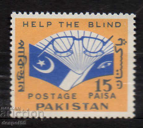 1965. Pakistan. Helping the blind.