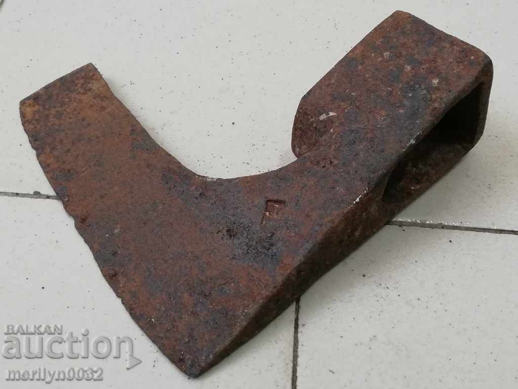 Old ax with stamped marking tool wrought iron