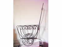 An old wrought iron cart