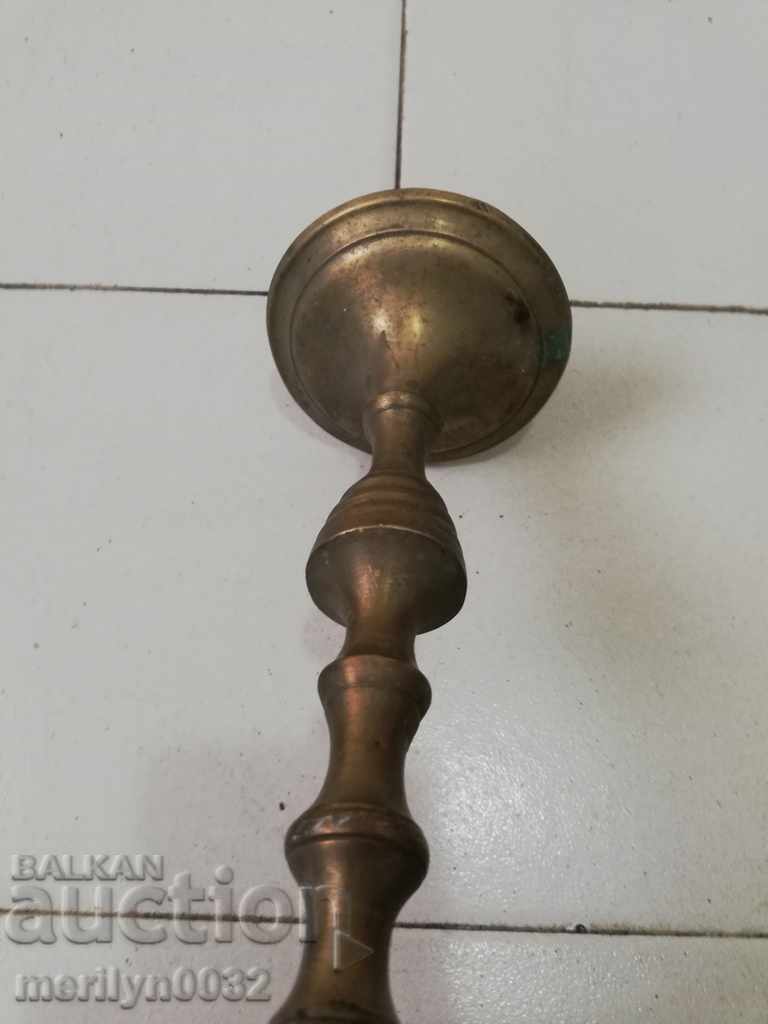 Auction  An Ottoman candlestick with a candle, a candle, a lamp