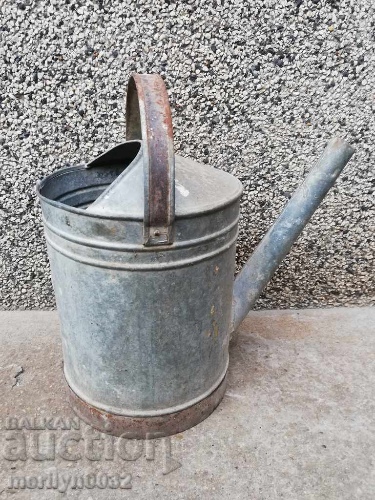 Old metal watering can, galvanized tube, bucket, container Old metal watering can, galvanized tube, bucket, container