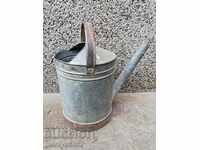Old metal watering can, galvanized tube, bucket, container