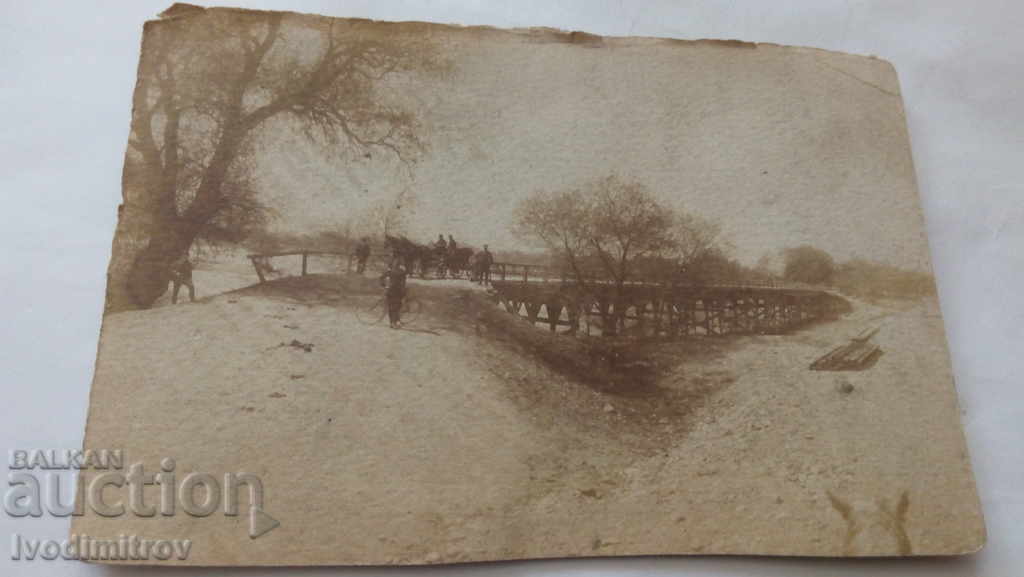 Postcard A wooden bridge over a dry riverbed
