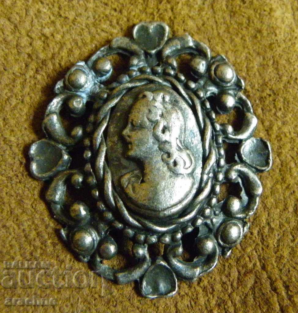 Baroque silver medallion