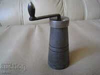 Antique old pepper and spice mill.