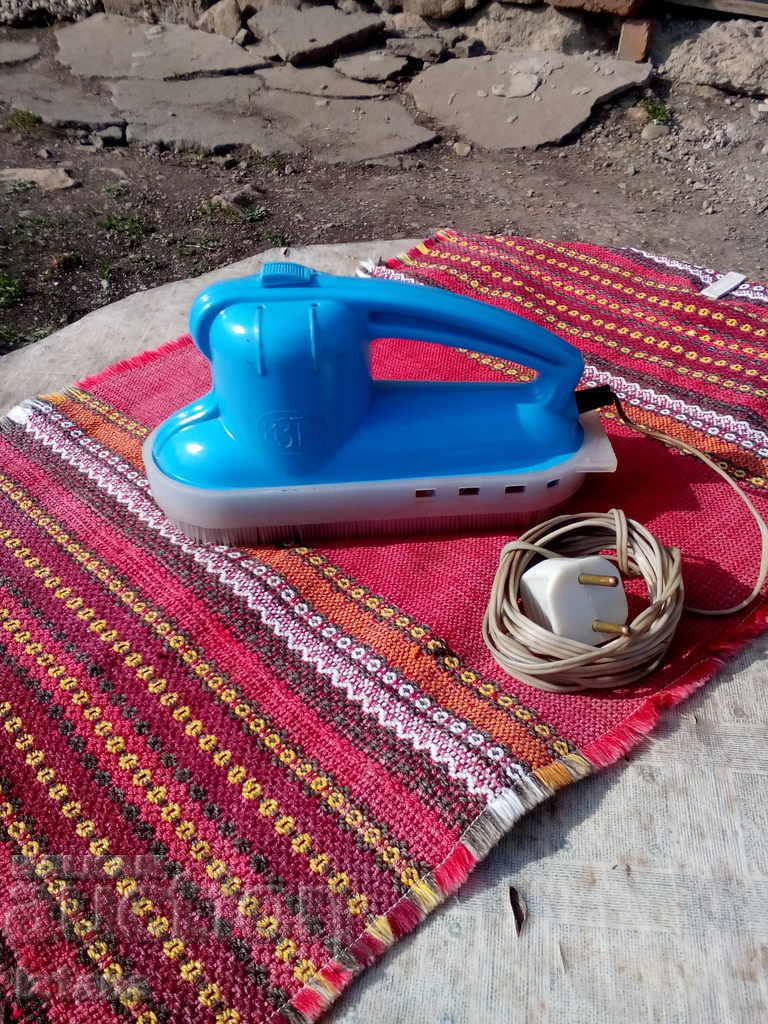 Old vacuum cleaner, clothes brush Old vacuum cleaner, clothes brush