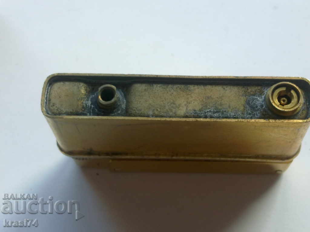 Auction An old, gilded lighter Auction An old, gilded lighter