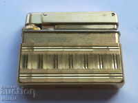 An old, gilded lighter
