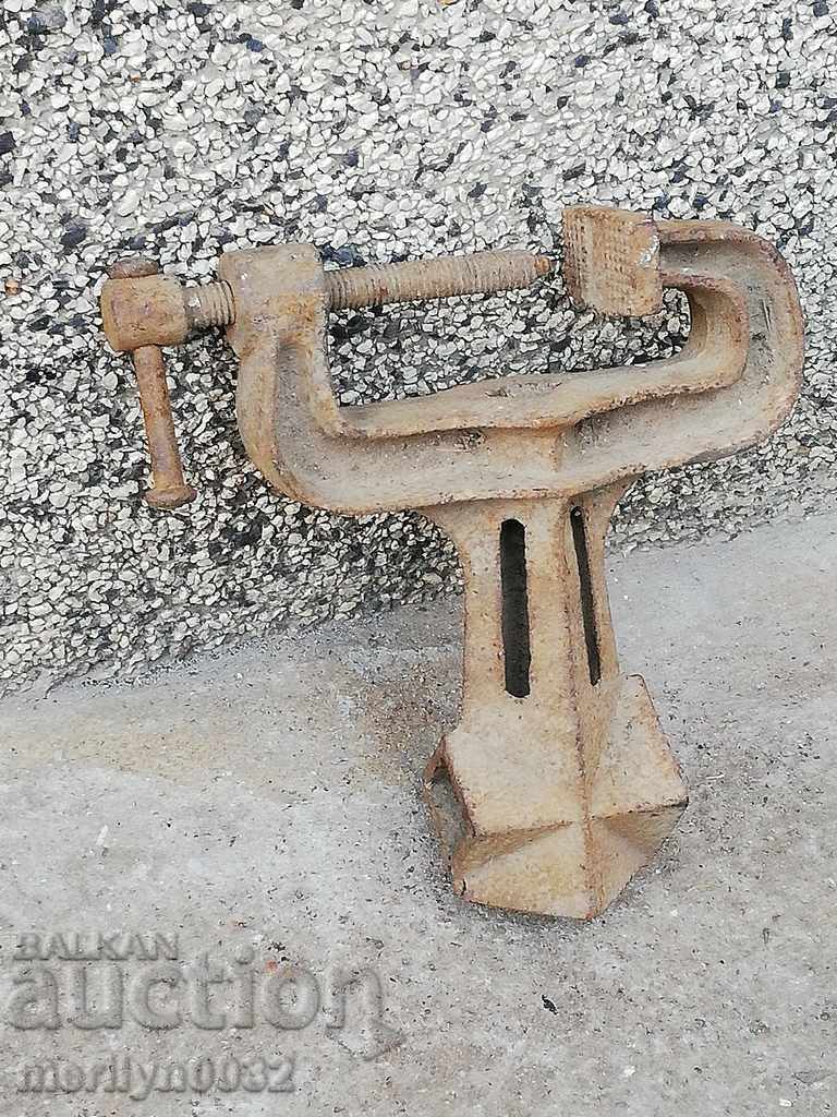 An old vise clamps a hardware tool with price 55.00 BGN | € 28.12