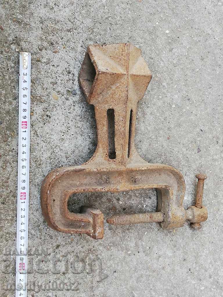 An old vise clamps a hardware tool - 5