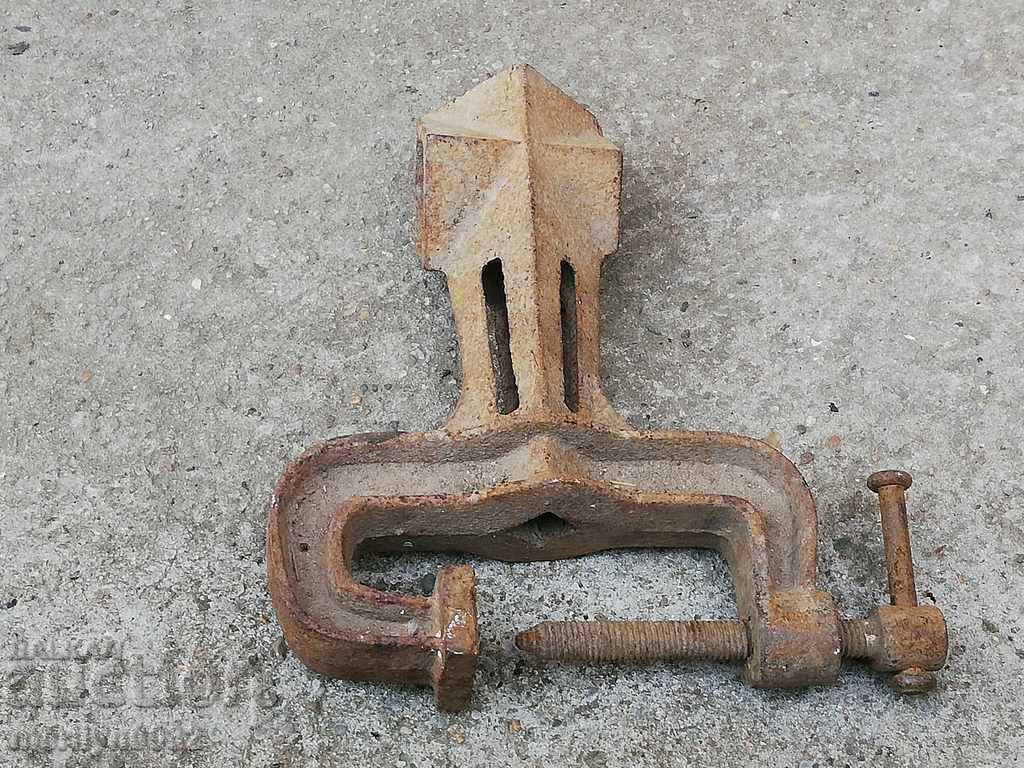 An old vise clamps a hardware tool - 6