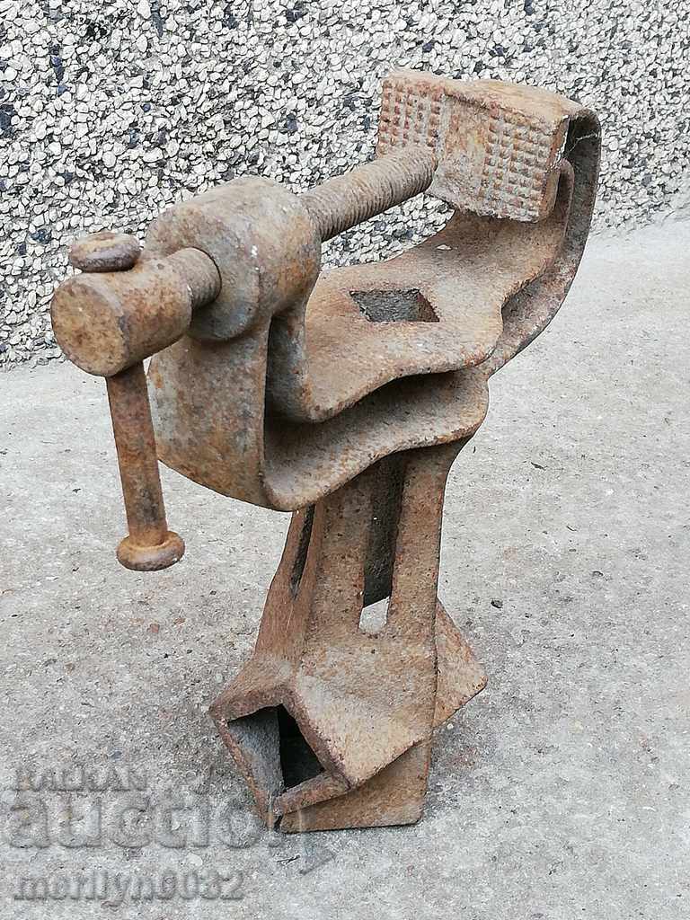 An old vise clamps a hardware tool - 7