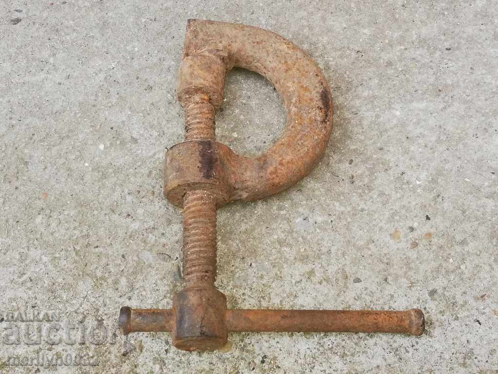 An old vise clamps a hardware tool - 5 An old vise clamps a hardware tool - 5