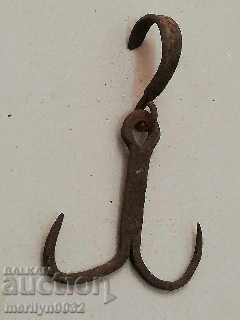 An old forged scraping hook, double mongrel cocktail