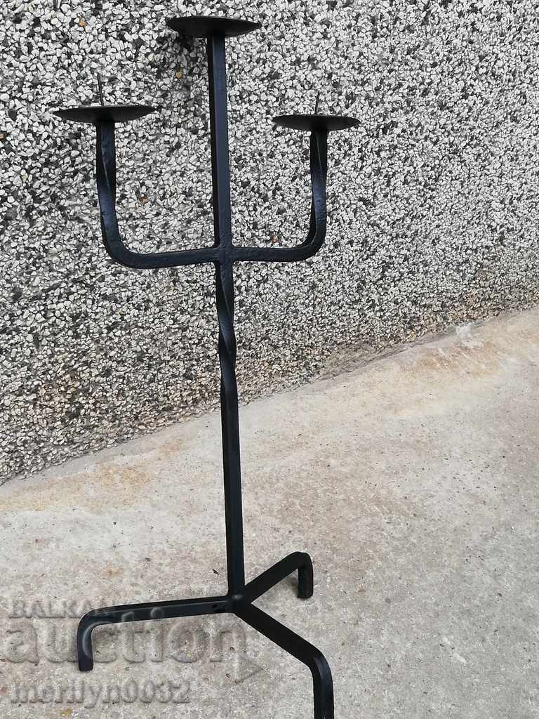Delivery of Old forged candlestick, candle, wrought iron candelabra Delivery of Old forged candlestick, candle, wrought iron candelabra