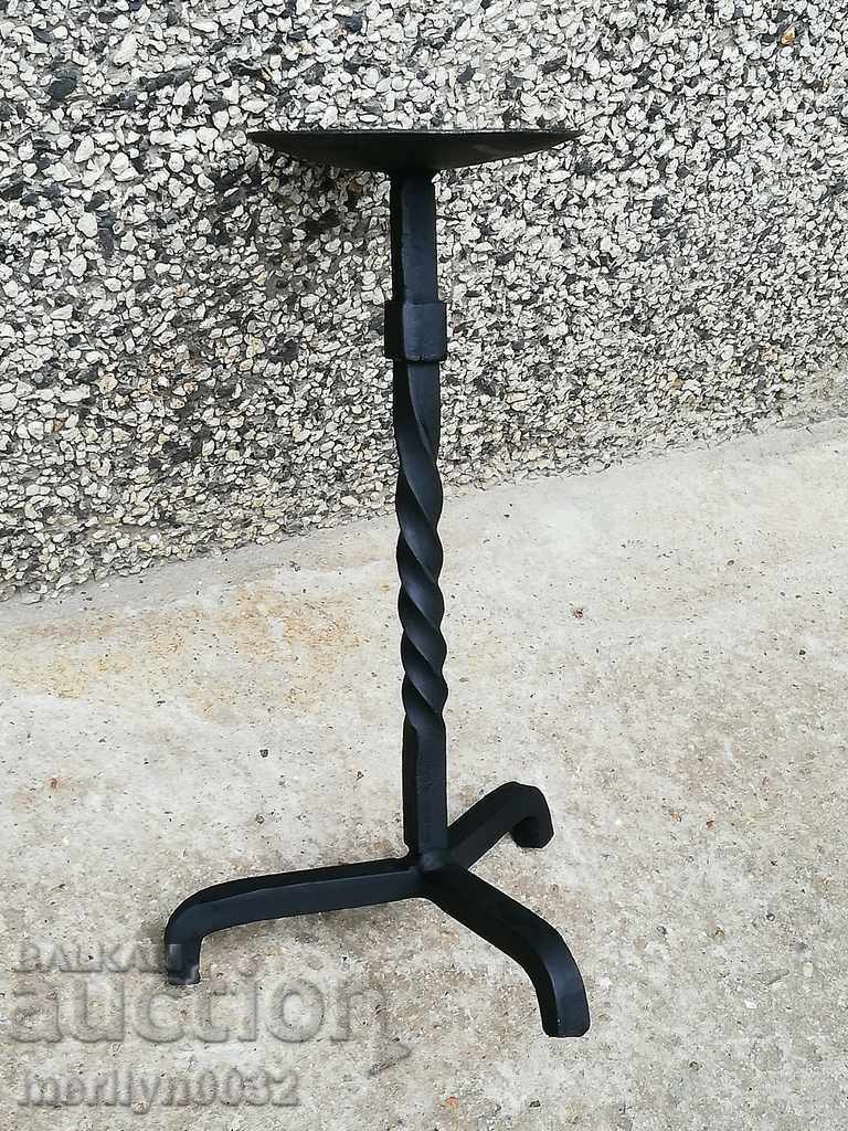 Old forged candlestick, candle, wrought iron candelabra