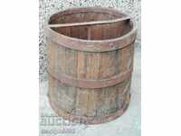 A double rail, a wooden bucket and a wooden bucket