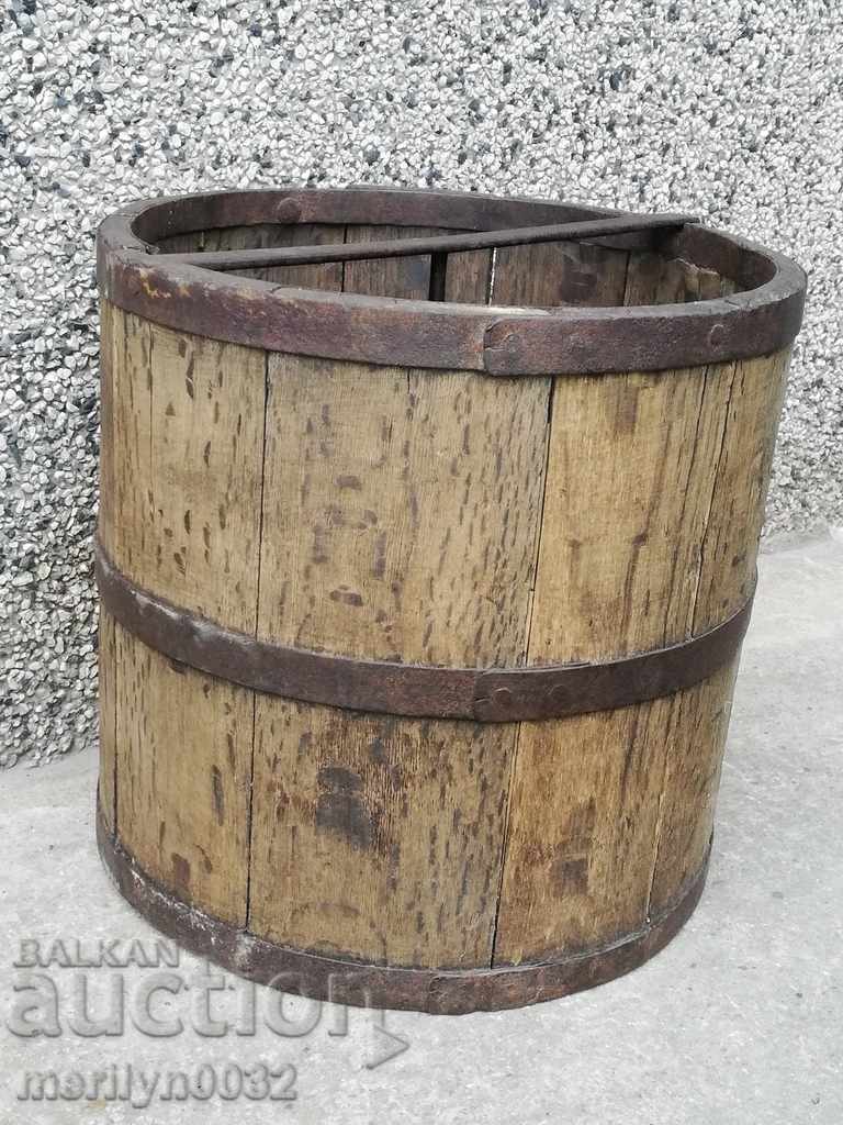 A double rail, a wooden bucket and a wooden bucket A double rail, a wooden bucket and a wooden bucket